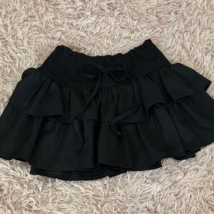 Black ruffle mini skirt
